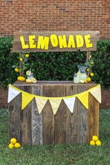 An empty lemonade stand ready for children to start selling lemonade on a hot summer day as their...