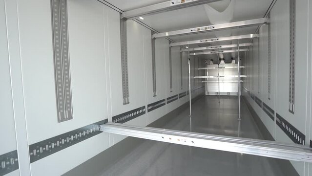 cargo empty semi-trailer with clean floor, rear close-up
