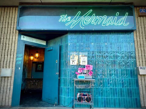 LOS ANGELES, CA, AUG 2021: emerald green exterior of The Mermaid bar, near the Arts District in Downtown