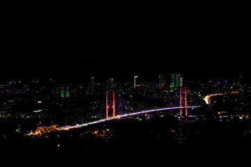 Istanbul night; bridge and city lights.