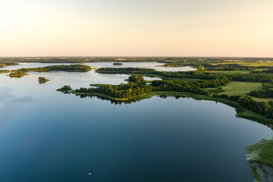 Aerial view of scenic Rubikiai lake, located near Anyksciai town, Lithuania. Landscape view from the above on summer sunset.