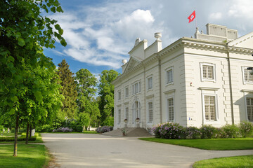 Fototapeta na wymiar Uzutrakis Manor, residential manor of the Tyszkiewicz family in Uzutrakis, on the shore of Lake Galve, opposite the famous Trakai Castle.