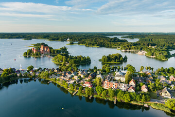 Aerial view of Trakai Island Castle and its surroundings, located in Trakai, Lithuania. Beautiful view from the above on summer sunset.