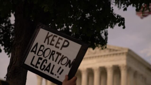 "Keep abortion legal" sign held in front of US Supreme Court during abortion rights protest 