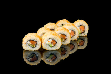 Hot roll with salmon and avocado tempura on black with reflection