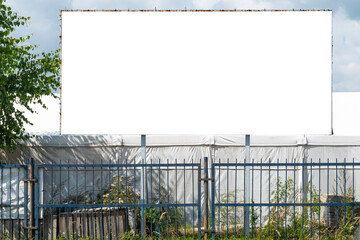 Blank white billboard for advertisement on a sunny day