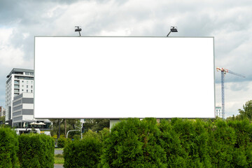 Advertising billboard mock-up in front of the construction site in the city center