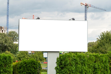 Advertising billboard mock-up in front of the construction site in the city center