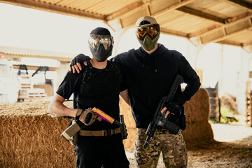 Airsoft soldiers preparing for battle at training ground