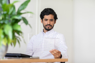 young man working as manager in an office