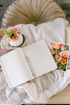 Journal with pen and picture of flowers
