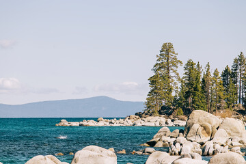 Stones and pines, view to spring peaceful Lake Tahoe