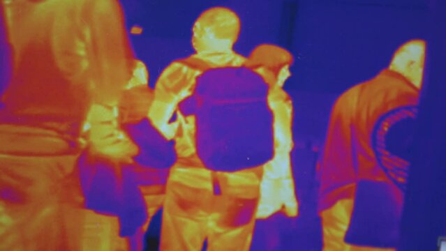 Infrared thermal vision of random walking people. Thermal vision of crowds.