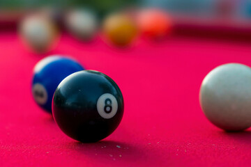 Pool Balls Are Lit On Fire While Sitting On A Pool Table In An Outdoor Environment
