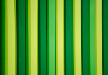 Green and yellow steel wall pattern in vertical line.