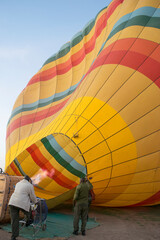Fototapeta premium Firing Up A Hot Air Balloon in the Maasai Mara, Kenya.