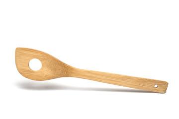 Closeup bamboo cooking spoon hole white background