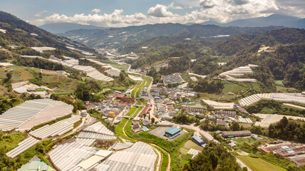 Aerial view over the Cameron Highlands, Malaysia from the sky. Aerial birds eye view over a dam in the Malaysian Cameron highlands. A drone capture of the highland landscape in the center of Malaysia