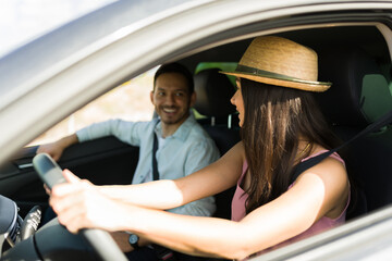 Happy couple having a good time on a road trip