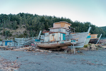 Several boats under construction and abandoned near Lebu beach, Chile