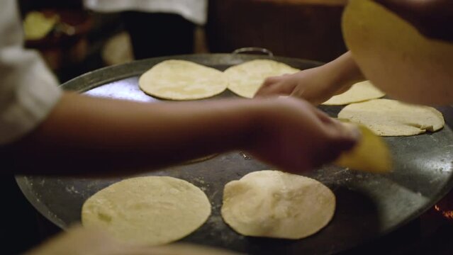 Women cooking tortillas 