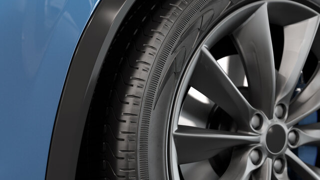New car rim with a tire in the wheel arch close-up. Treaded rubber, shallow depth of field. 3d illustration