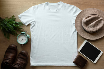 Mockup of a white t-shirt blank shirt template with accessories on the wooden table background,...