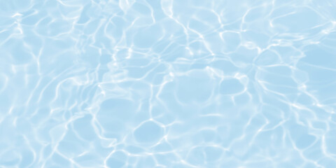 de-focused. Closeup of light blue transparent clear calm water surface texture with splashes and bubbles. Trendy abstract summer nature background. for a product, advertising,text space.