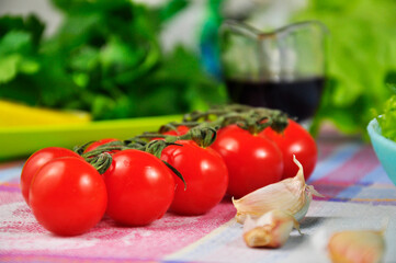 Red cherry tomatoes on the table.