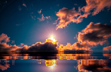  reflection of colorful dramatic sky with clouds, steaming cumulonimbus clouds reflect golden light