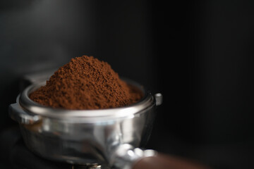 Freesh ground coffee in portafilter from grinder