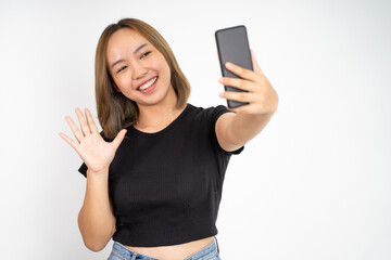young woman make a video call using mobile phone with saying hello gesture on isolated background