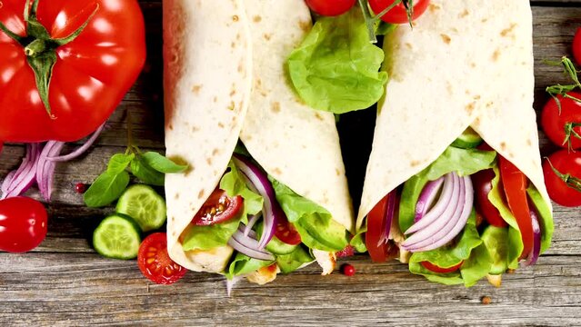 healthy tortilla wrap with grilled chicken and vegetables