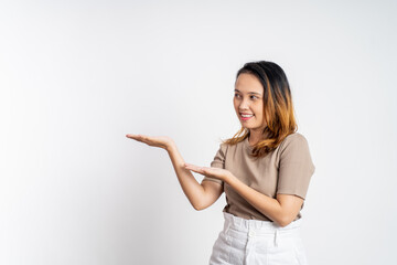 Asian girl with hand gesture presenting something on isolated background