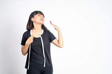 Fototapeta premium panicked young woman with worried gesture of both hands on isolated background. woman feel hot
