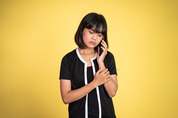 unhappy woman making a call using a smart phone when she hear bad news on isolated background