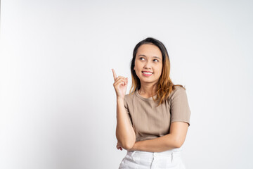 attractive asian woman with finger pointing up hand gesture on isolated background