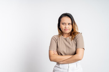 Fototapeta premium young woman stand cross hand with unhappy sad face on isolated background