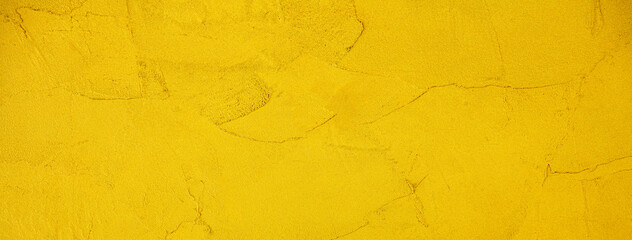 黄色くペイントされた壁の背景テクスチャー