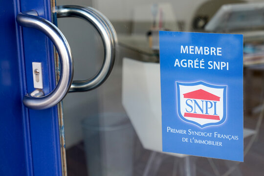 snpi conseil immobilier agree brand logo and sign text on entrance door facade real estate agency office