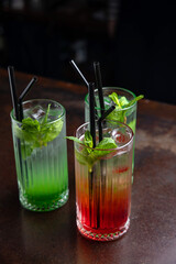 Three assorted cocktails at the bar 
