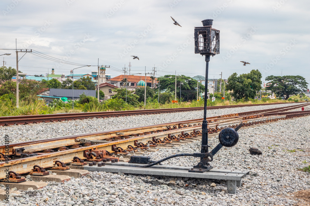 Sticker a railway switch or track construction in close proximity to a railway station