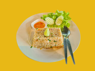 Unique Thai style shrimp fried rice on isolated orange background.