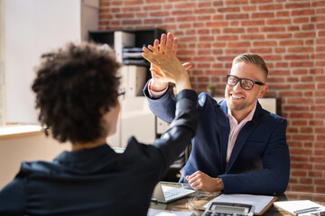 Disabled Businessman Giving High Five To His Partner