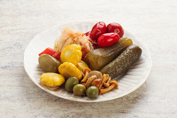 Plate with pickled vegetables and mushrooms