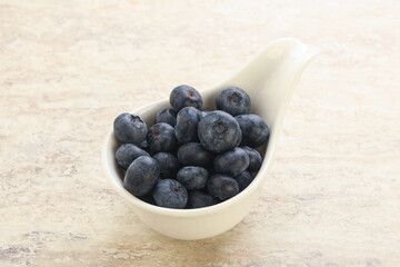 Sweet ripe blueberry heap in the bowl