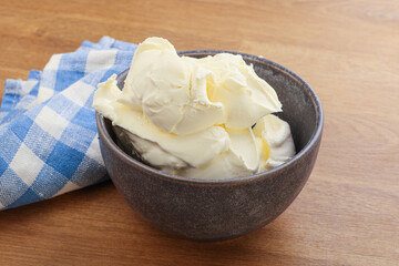 Italian soft mascarpone cheese in the bowl