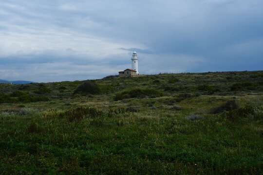 Lighthouse With Small Building In A Wide Green Natural Landscape