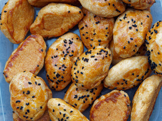 Fresh baked homemade salty cookies with feta cheeese and parsley