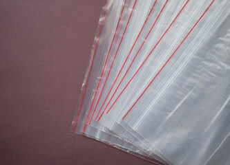 A set of plastic zip bags. Transparent plastic bags on a dark background.